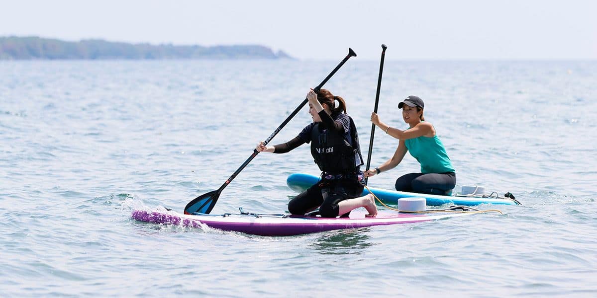 Sakurajima Volcano SUP Yoga Experience at Kagoshima Kinko Bay sup yoga standup paddleboarding yoga session class booking kagoshima kinko bay kyushu japan